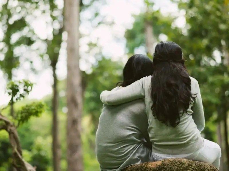 hugging female friends