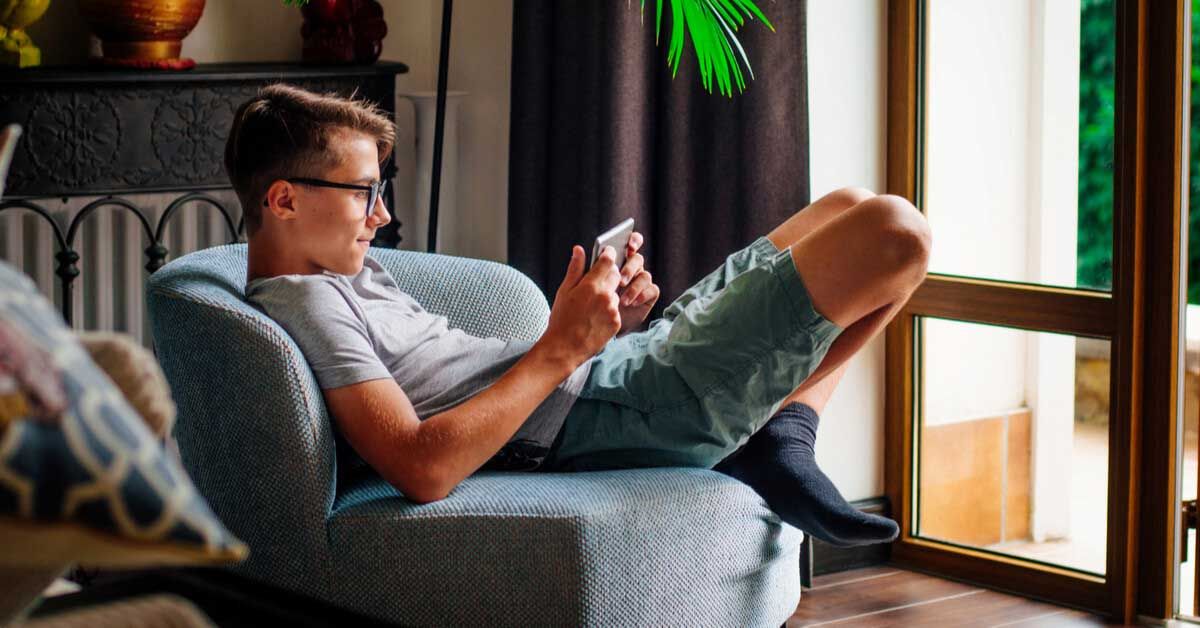 Generation Z male texts friends. 