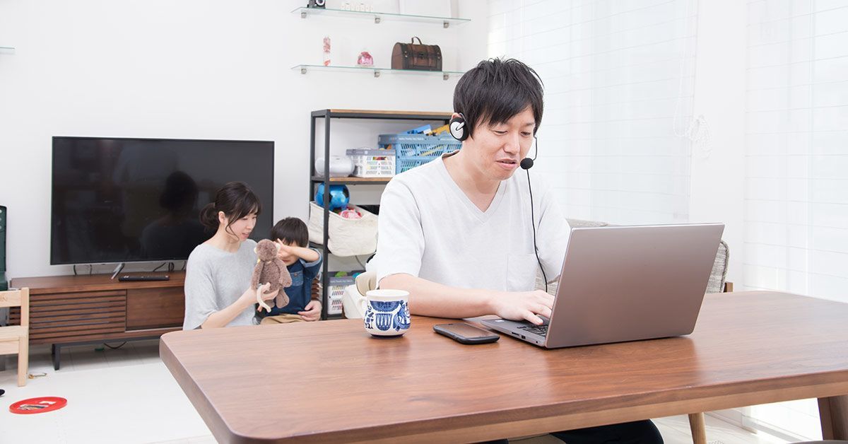 Kids playing while father works