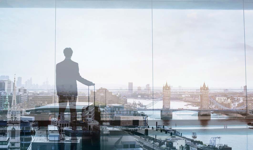 man standing behind window