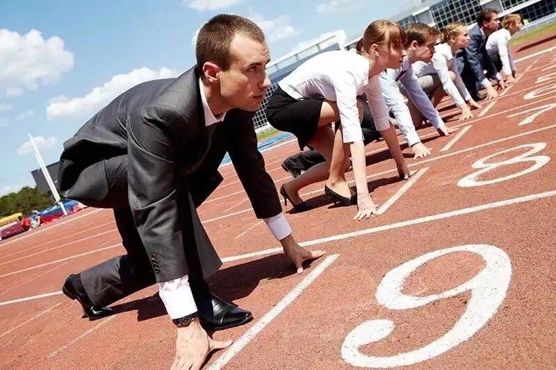 Business people getting ready to race