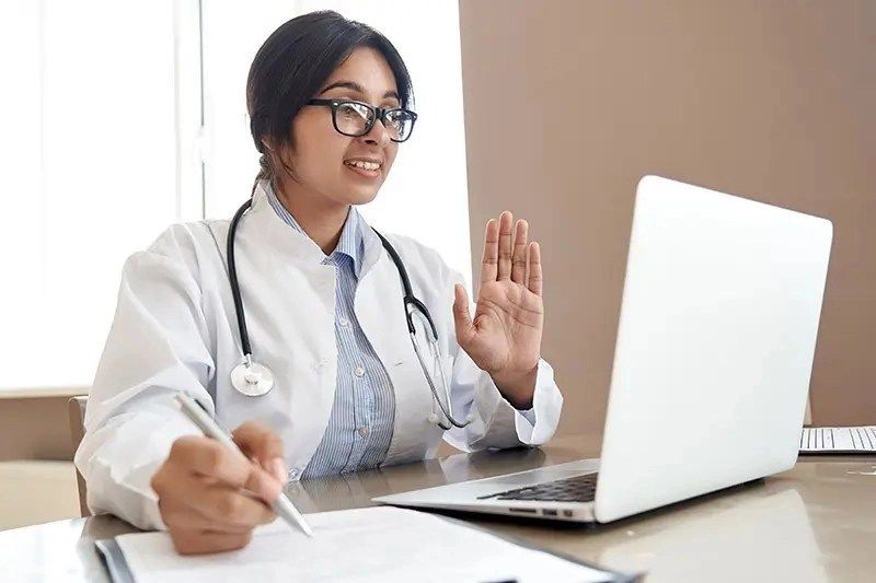 a person in a white coat