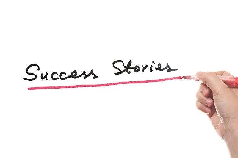 Success Stories in words written on white