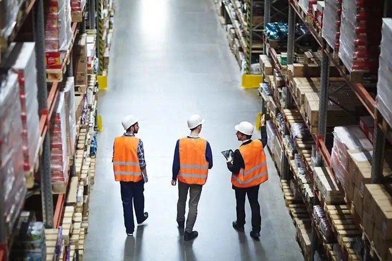 Warehouse workers in hardhats