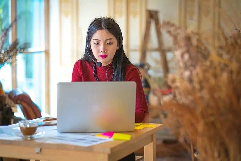 woman working from home on a video conference call