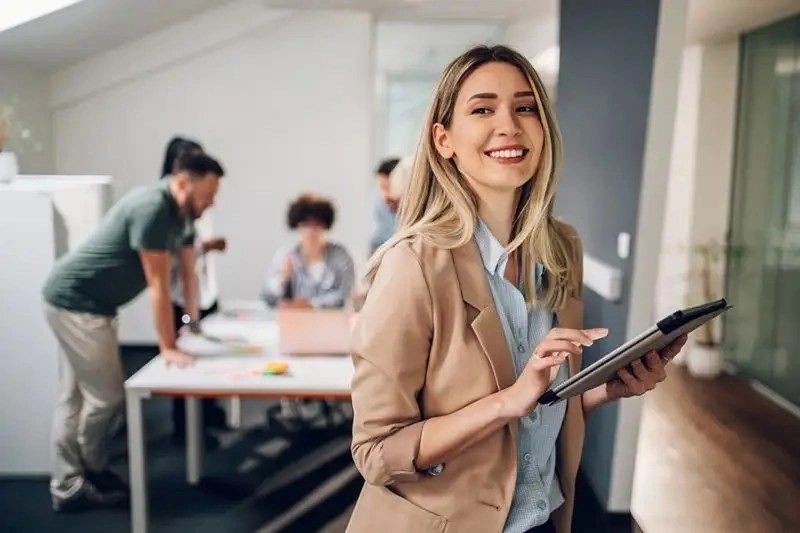 a woman holding a tablet