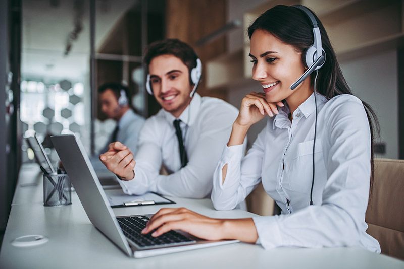 call center workers in headphones