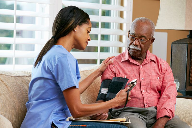 nurse visiting senior