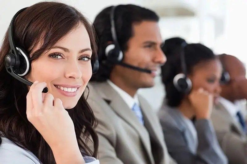 smiling worker doing her job headset