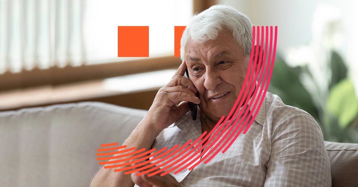 An old man using his mobile phone