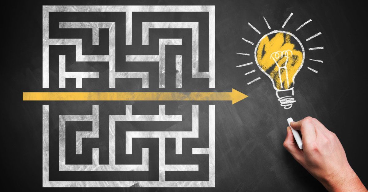 Maze to an idea on a chalkboard