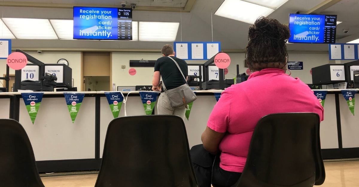 Women sits at DMV but expects to be able to reach government agencies digitally especially during COVID-19.