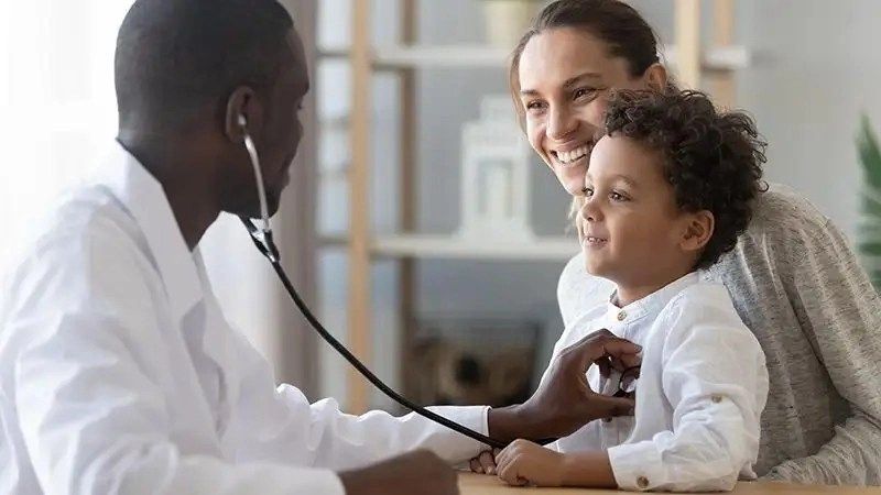 a doctor talking to a child