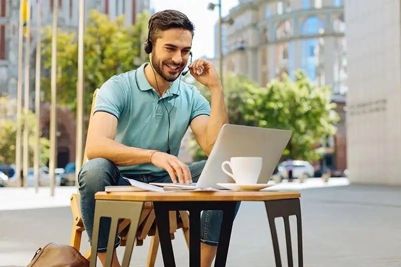 Savvy Energetic Guy Calling Someone Online